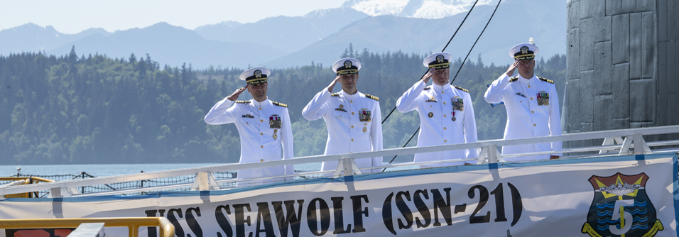 Members of the official party depart the Seawolf-class fast-attack submarine USS Seawolf (SSN 21) following a change of command ceremony held at Naval Base Kitsap-Bangor in Silverdale, Washington, May 16, 2023. During the ceremony, Cmdr. Jeffrey Fassbender was relieved by Cmdr. Douglas Hagenbuch. (U.S. Navy photo by Mass Communication Specialist Seaman Sophia H. Bumps)