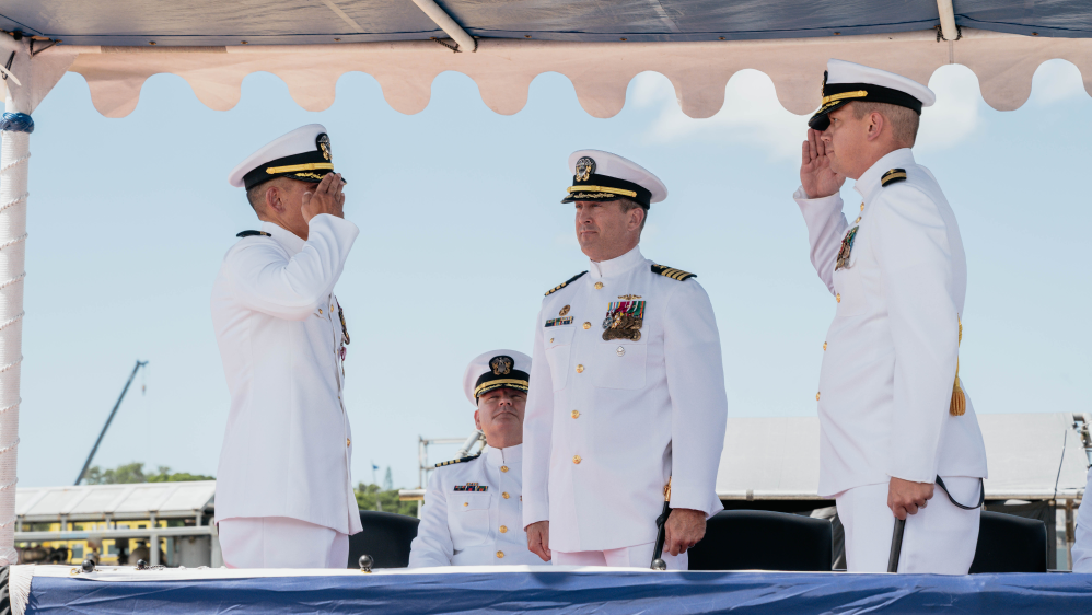 JOINT BASE PEARL HARBOR-HICKAM, Hawaii (Sep. 18, 2025) - Cmdr. Alex Rinaldi, incoming commanding officer of Virginia-class fast-attack submarine USS Mississippi (SSN 782), right, salutes Cmdr. Jeffrey Bernhardt, outgoing commanding officer of Mississippi, left, while Capt. Chris Hedrick, commander, Submarine Squadron 1, center, observes during the Mississippi’s change of command ceremony on Joint Base Pearl Harbor-Hickam, Hawaii, Sep. 18, 2025. Mississippi is assigned to Submarine Squadron 1 and is capable of supporting various missions, including anti-submarine warfare, anti-surface ship warfare, strike warfare, special operations forces support, and intelligence, surveillance, and reconnaissance. (U.S. Navy photo by Mass Communication Specialist 2nd Class Nicholas Russell)