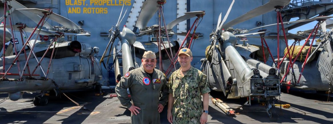 Rear Adm. Marcos Jasso, commander, Carrier Strike Group (CSG) 9, left, poses for a photo with Rear Adm. Chris Cavanaugh, commander, Submarine Force, U.S. Pacific Fleet, during the exercise Rim of the Pacific (RIMPAC), aboard Nimitz-class aircraft carrier USS Theodore Roosevelt (CVN 71), July 30, 2026. Thirty nations, over 30 surface ships, five submarines, 15 national land forces, more than 206 aircraft and 30,000 personnel are participating in RIMPAC in and around the Hawaiian Islands, June 24 to July 31. The world’s largest international maritime exercise, RIMPAC provides a unique training opportunity while fostering and sustaining cooperative relationships among participants critical to ensuring safety of sea lanes and security on the world’s oceans. RIMPAC 2026 is the 30th exercise in the series that began in 1971. (U.S. Navy photo by Mass Communication Specialist 2nd Class Ryan Holloway)