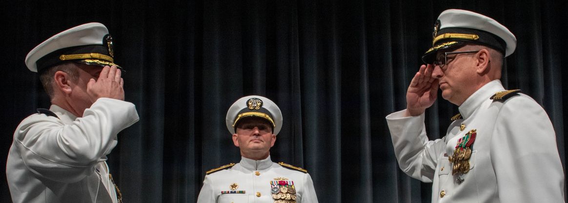 260604-N-MZ309-1177 KEYPORT, Wash. (June 4, 2026) Capt. Lacy Lodmell relieves Capt. Rob Garis as commodore of Submarine Squadron (CSS) 19 during a change of command ceremony at the U.S. Naval Undersea Museum in Keyport, Washington, June 4, 2026. CSS-19 is subordinate to Commander, Submarine Group (SUBGRU) 9 which exercises administrative and operational control of assigned submarine commands and units in the Pacific Northwest, providing oversight for shipboard training, personnel, and the supply and material readiness of SSBNs and their crews. SUBGRU-9 is also responsible for nuclear submarines undergoing conversion or overhaul at Puget Sound Naval Shipyard in Bremerton. (U.S. Navy photo by Mass Communication Specialist 1st Class Ryan Riley)